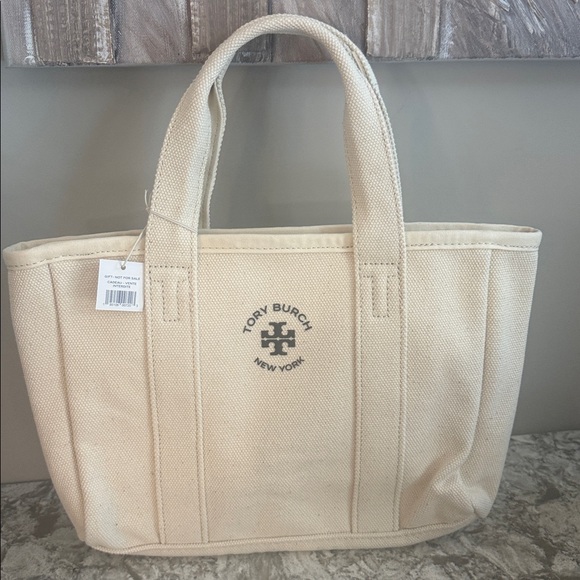 Tory Burch Handbags - Tory Burch Cream Canvas Tote Bag brand new with tags! Logo on front